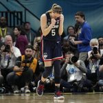 
              UConn's Paige Bueckers reacts after a college basketball game against Stanford in the semifinal round of the Women's Final Four NCAA tournament Friday, April 1, 2022, in Minneapolis. UConn won 63-58 to advance to the finals. (AP Photo/Eric Gay)
            