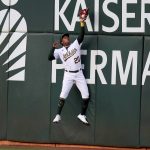 
              Oakland Athletics' Cristian Pache (20) catches a ball hit by Baltimore Orioles' Kelvin Gutierrez during the second inning of a baseball game in Oakland, Calif., on Tuesday, April 19, 2022. (AP Photo/Scot Tucker)
            