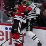 
              Dallas Stars defenseman Jani Hakanpaa, right, is checked by Chicago Blackhawks right wing MacKenzie Entwistle during the second period of an NHL hockey game in Chicago, Sunday, April, 10, 2022. (AP Photo/Nam Y. Huh)
            