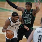 
              Brooklyn Nets forward Bruce Brown (1) drives with the ball as Boston Celtics guard Marcus Smart (36) defends in the second half of Game 1 of an NBA basketball first-round Eastern Conference playoff series, Sunday, April 17, 2022, in Boston. The Celtics won 115-114. (AP Photo/Steven Senne)
            