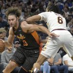 
              Orlando Magic center Robin Lopez (33) drives to the basket as Cleveland Cavaliers center Moses Brown (6) defends during the second half of an NBA basketball game, Tuesday, April 5, 2022, in Orlando, Fla. (AP Photo/Phelan M. Ebenhack)
            
