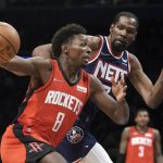 
              Houston Rockets forward Jae'Sean Tate (8) drives against Brooklyn Nets forward Kevin Durant (7) during an NBA basketball game, Tuesday April 5, 2022, in New York. (AP Photo/Bebeto Matthews)
            