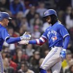 
              Toronto Blue Jays' Raimel Tapia, right, is congratulated by Matt Chapman after his two-run home run during the second inning of the team's baseball game against the Boston Red Sox, Wednesday, April 20, 2022, at Fenway Park in Boston. (AP Photo/Charles Krupa)
            