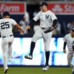 
              New York Yankees' Aaron Judge, center, celebrates with Gleyber Torres, left, and Isiah Kiner-Falefa after the team's 4-0 win over the Toronto Blue Jays in a baseball game Tuesday, April 12, 2022, in New York. (AP Photo/Frank Franklin II)
            