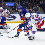 
              New York Rangers' Andrew Copp (18) shoots the puck past New York Islanders goaltender Semyon Varlamov (40) for a goal during the first period of an NHL hockey game Thursday, April 21, 2022, in Elmont, N.Y. (AP Photo/Frank Franklin II)
            