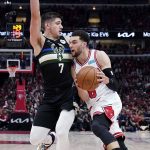 
              Chicago Bulls guard Zach LaVine, right, drives against Milwaukee Bucks guard Grayson Allen during the first half of Game 4 of a first-round NBA basketball playoff series, Sunday, April 24, 2022, in Chicago. (AP Photo/Nam Y. Huh)
            