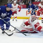 
              Toronto Maple Leafs center Auston Matthews (34) scores on Detroit Red Wings goaltender Alex Nedeljkovic (39) during the second period of an NHL hockey game in Toronto, Tuesday, April 26, 2022. (Frank Gunn/The Canadian Press via AP)
            