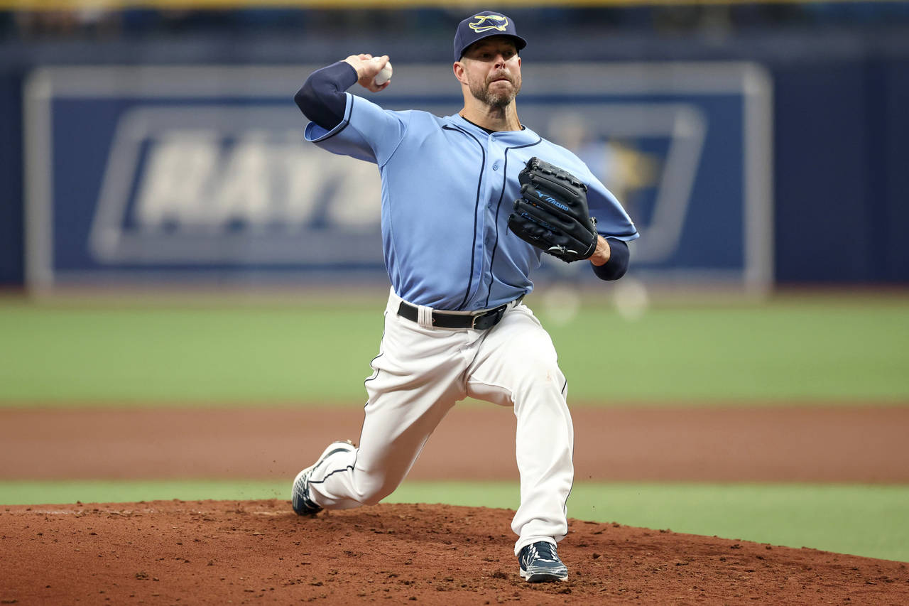 Tampa Bay Rays starting pitcher Corey Kluber throws during the second inning of a baseball game aga...