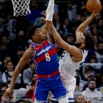 
              Minnesota Timberwolves center Karl-Anthony Towns (32) shoots as Washington Wizards forward Rui Hachimura (8) defends during the third quarter of an NBA basketball game Tuesday, April 5, 2022, in Minneapolis. The Wizards won 132-114. (AP Photo/Bruce Kluckhohn)
            