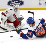
              New York Islanders left wing Kieffer Bellows (20) plays the puck against Carolina Hurricanes goaltender Antti Raanta (32) during the second period of an NHL hockey game, Sunday, Apr. 24, 2022, in New York. (AP Photo/Noah K. Murray)
            