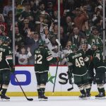Minnesota Wild right wing Mats Zuccarello (36) celebrates with teammates after scoring a goal against the Seattle Kraken during the second period of an NHL hockey game, Friday, April 22, 2022, in St. Paul, Minn. (AP Photo/Stacy Bengs)
