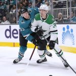 
              Dallas Stars right wing Denis Gurianov (34) and San Jose Sharks defenseman Nicolas Meloche (53) vie for the puck during the second period of an NHL hockey game Saturday, April 2, 2022, in San Jose, Calif. (AP Photo/Tony Avelar)
            