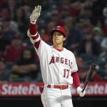 
              Los Angeles Angels designated hitter Shohei Ohtani (17) signals to base runners after hitting a foul ball during the fifth inning of a baseball game against the Houston Astros in Anaheim, Calif., Saturday, April 9, 2022. (AP Photo/Ashley Landis)
            