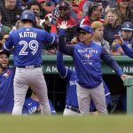 
              Toronto Blue Jays' Gosuke Katoh (29) is welcomed to the dugout after scoring on a single by teammate Bo Bichette in the third inning of a baseball game against the Boston Red Sox, Thursday, April 21, 2022, in Boston. (AP Photo/Steven Senne)
            
