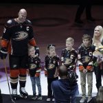 
              Anaheim Ducks' Ryan Getzlaf, left, and his family stand for a photo during a pre-game ceremony held to honor Getzlaf before the team's NHL hockey game against the St. Louis Blues Sunday, April 24, 2022, in Anaheim, Calif. Getzlaf will end a 17-year NHL career spent entirely with the Ducks at the conclusion of the season. (AP Photo/Jae C. Hong)
            