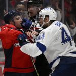
              Tampa Bay Lightning defenseman Jan Rutta (44) scuffles with Washington Capitals left wing Conor Sheary, left, during the second period of an NHL hockey game Wednesday, April 6, 2022, in Washington. (AP Photo/Nick Wass)
            