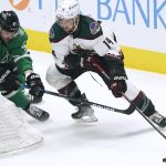 
              Arizona Coyotes defenseman Shayne Gostisbehere (14) skates with the puck against Dallas Stars right wing Alexander Radulov (47) during the first period of an NHL hockey game in Dallas, Wednesday, April 27, 2022. (AP Photo/LM Otero)
            