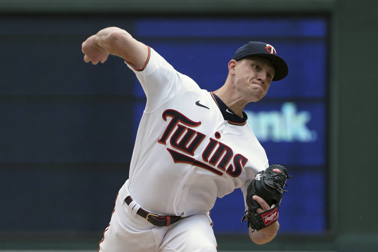 Minnesota Twins pitcher Cody Stashak throws in relief of starter Bailey Ober in the fourth inning o...