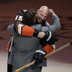 
              Anaheim Ducks' Ryan Getzlaf hugs his former teammate Teemu Selanne during a pre-game event held to honor Getzlaf before the team's NHL hockey game against the St. Louis Blues Sunday, April 24, 2022, in Anaheim, Calif. Getzlaf will end a 17-year NHL career spent entirely with the Ducks at the conclusion of the season. (AP Photo/Jae C. Hong)
            