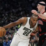 
              Milwaukee Bucks' Khris Middleton tries to get past Chicago Bulls' Alex Caruson during the first half of Game 1 of their first round NBA playoff basketball game Sunday, April 17, 2022, in Milwaukee. (AP Photo/Morry Gash)
            