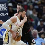 
              New Orleans Pelicans center Jonas Valanciunas (17) drives past Portland Trail Blazers forward Drew Eubanks in the first half of an NBA basketball game in New Orleans, Thursday, April 7, 2022. (AP Photo/Gerald Herbert)
            