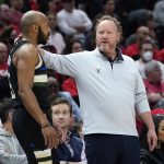 
              Milwaukee Bucks head coach Mike Budenholzer, right, talks to guard Jevon Carter during the first half of Game 4 of a first-round NBA basketball playoff series against the Chicago Bulls, Sunday, April 24, 2022, in Chicago. (AP Photo/Nam Y. Huh)
            