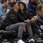 
              Denver Broncos quarterback Russell Wilson, left, gives a kiss to his wife, Ciara, as they watched the Denver Nuggets play against the Memphis Grizzlies during the second half of an NBA basketball game Thursday, April 7, 2022, in Denver. (AP Photo/David Zalubowski)
            