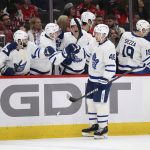 
              Toronto Maple Leafs defenseman Ilya Lyubushkin (46) celebrates after his goal during the first period of an NHL hockey game against the Washington Capitals, Sunday, April 24, 2022, in Washington. (AP Photo/Nick Wass)
            