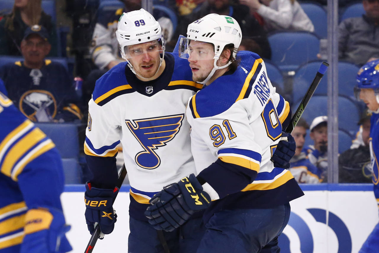 CORRECTS PLAYER AT RIGHT TO ST. LOUIS BLUES' VLADIMIR TARASENKO, INSTEAD OF BUFFALO SABRES' DRAKE C...