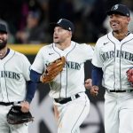 
              Seattle Mariners outfielders Jesse Winker, left, Jarred Kelenic, center, and Julio Rodriguez run off the field after the Mariners defeated the Texas Rangers 4-2 in a baseball game Wednesday, April 20, 2022, in Seattle. (AP Photo/Ted S. Warren)
            