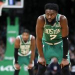 
              Boston Celtics' Jaylen Brown (7) and Marcus Smart (36) wait for play to resume during the second half of Game 2 of an NBA basketball first-round Eastern Conference playoff series against the Brooklyn Nets, Wednesday, April 20, 2022, in Boston. (AP Photo/Michael Dwyer)
            