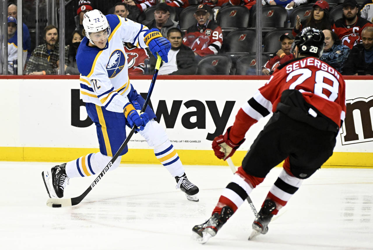 Buffalo Sabres right wing Tage Thompson (72) shoots as New Jersey Devils defenseman Damon Severson ...