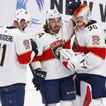 
              Florida Panthers left wing Jonathan Huberdeau (11) and left wing Ryan Lomberg (94) celebrate a victory with goaltender Spencer Knight (30) following the third period of an NHL hockey game against the Buffalo Sabres, Sunday, April 3, 2022, in Buffalo, N.Y. (AP Photo/Jeffrey T. Barnes)
            
