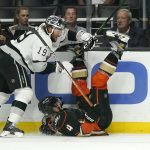 
              Anaheim Ducks defenseman Cam Fowler, right, falls while under pressure from Los Angeles Kings left wing Alex Iafallo during the second period of an NHL hockey game Saturday, April 23, 2022, in Los Angeles. (AP Photo/Mark J. Terrill)
            
