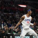 
              FILE - Los Angeles Clippers guard Terance Mann celebrates after dunking during the second half of an NBA basketball game against the New Orleans Pelicans, April 3, 2022, in Los Angeles. (AP Photo/Mark J. Terrill, File)
            