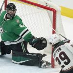
              Arizona Coyotes center Barrett Hayton (29) scores against Dallas Stars goaltender Scott Wedgewood (41) during the third period of an NHL hockey game in Dallas, Wednesday, April 27, 2022. The Coyotes won 4-3 in overtime. (AP Photo/LM Otero)
            