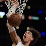 
              New Orleans Pelicans center Jaxson Hayes (10) dunks during the first half of an NBA basketball game against the Los Angeles Lakers in Los Angeles, Friday, April 1, 2022. (AP Photo/Ashley Landis)
            
