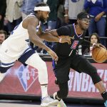 
              Los Angeles Clippers guard Reggie Jackson (1) drives on Minnesota Timberwolves guard Patrick Beverley (22) during the first quarter of an NBA basketball game Tuesday, April 12, 2022, in Minneapolis. (AP Photo/Andy Clayton-King)
            