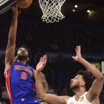 
              Detroit Pistons guard Braxton Key (8) goes up to shoot over Oklahoma City Thunder forward Olivier Sarr (30) in the first half of an NBA basketball game, Friday, April 1, 2022, in Oklahoma City. (AP Photo/Kyle Phillips)
            
