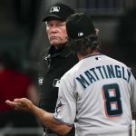 
              Miami Marlins manager Don Mattingly (8) argues with umpire Ted Barrett after the Atlanta Braves stole a base during the sixth inning of a baseball game Saturday, April 23, 2022, in Atlanta. (AP Photo/John Bazemore)
            