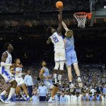 
              Duke's AJ Griffin (21) shoots over North Carolina's Brady Manek (45) during the first half of a college basketball game in the semifinal round of the Men's Final Four NCAA tournament, Saturday, April 2, 2022, in New Orleans. (AP Photo/David J. Phillip)
            