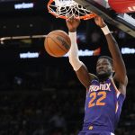 
              Phoenix Suns center Deandre Ayton dunks against the Los Angeles Lakers during the second half of an NBA basketball game Tuesday, April 5, 2022, in Phoenix. The Suns won 121-110. (AP Photo/Rick Scuteri)
            
