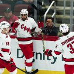 
              Carolina Hurricanes center Vincent Trocheck (16) celebrates his goal against the Arizona Coyotes with Hurricanes center Martin Necas (88) and Hurricanes right wing Andrei Svechnikov (37) during the first period of an NHL hockey game Monday, April 18, 2022, in Glendale, Ariz. (AP Photo/Ross D. Franklin)
            