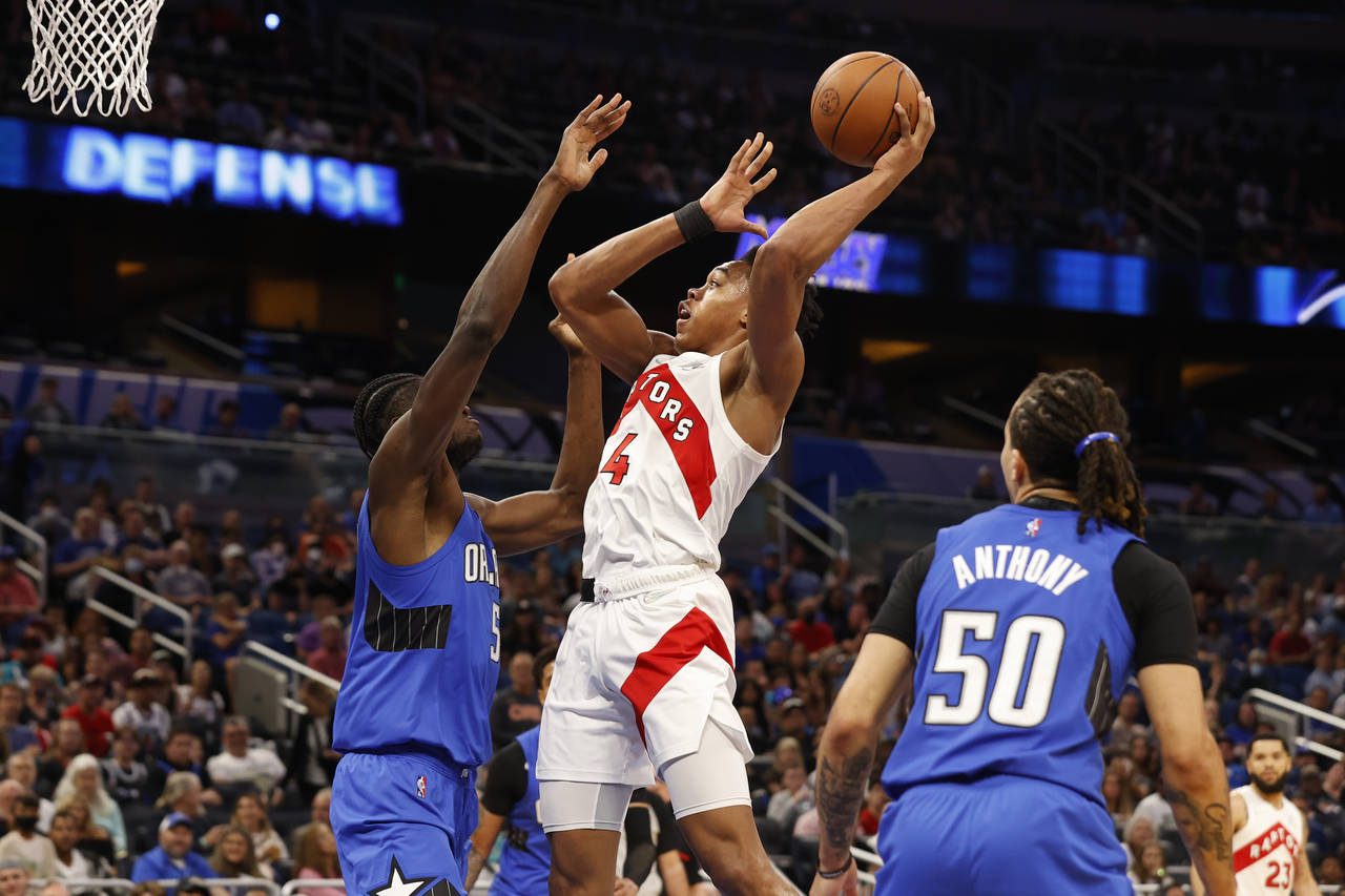 Toronto Raptors forward Scottie Barnes (4) shoots over Orlando Magic center Mo Bamba (5) during the...