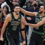 
              Boston Celtics forward Jayson Tatum (0) celebrates with guard Derrick White (9) after making a layup at the buzzer to score and win Game 1 of an NBA basketball first-round Eastern Conference playoff series against the Brooklyn Nets, Sunday, April 17, 2022, in Boston. The Celtics won 115-114. (AP Photo/Steven Senne)
            