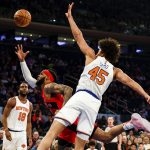 
              Toronto Raptors guard Gary Trent Jr. (33) loses control of the ball against New York Knicks forward Jericho Sims (45) during the first half of an NBA basketball game, Sunday, April 10, 2022 in New York. (AP Photo/Jessie Alcheh)
            