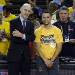 
              FILE - Golden State Warriors' Stephen Curry, right, smiles with NBA Commissioner Adam Silver as Curry was presented with NBA Most Valuable Player award before Game 5 of the team's second-round playoff series against the Portland Trail Blazers on May 11, 2016, in Oakland, Calif. (AP Photo/Marcio Jose Sanchez, File)
            