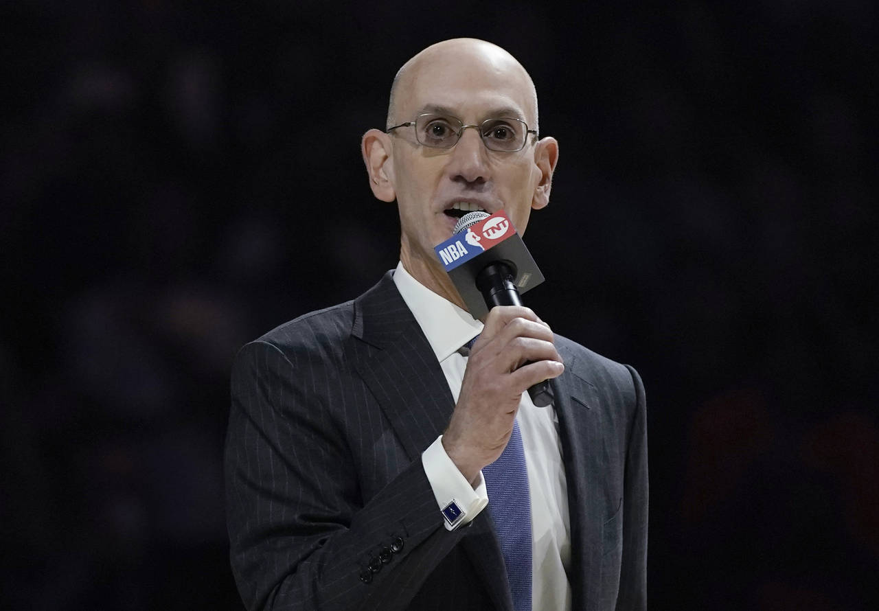 FILE - NBA Commissioner Adam Silver speaks before an NBA basketball game between the Milwaukee Buck...