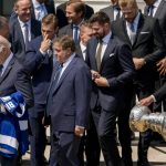 
              Tampa Bay Lightning captain Steven Stamkos, right, carries the Stanley Cup behind President Joe Biden, second from left, owner Jeff Vinik, center left, and his wife Penny, left, and other members of the team following an event to celebrate the Tampa Bay Lightning's 2020 and 2021 Stanley Cup championships at the White House in Washington, Monday, April 25, 2022. (AP Photo/Andrew Harnik)
            
