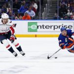 
              New York Islanders' Jean-Gabriel Pageau (44) tries to control the puck next to Washington Capitals' Evgeny Kuznetsov (92) during the second period of an NHL hockey game Thursday, April 28, 2022, in Elmont, N.Y. (AP Photo/Frank Franklin II)
            
